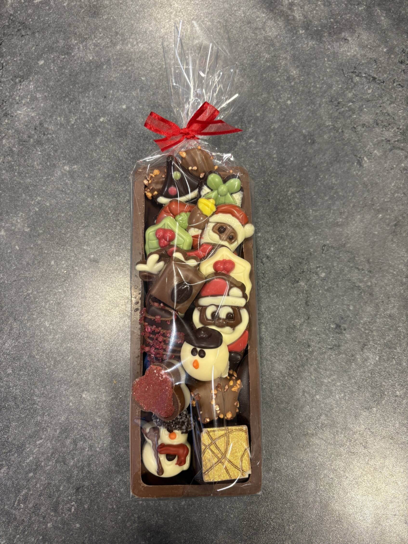 Boomstam gevuld met kerstchocolade